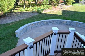 Retaining Wall Defines Patio - Distinctive Deck Designs