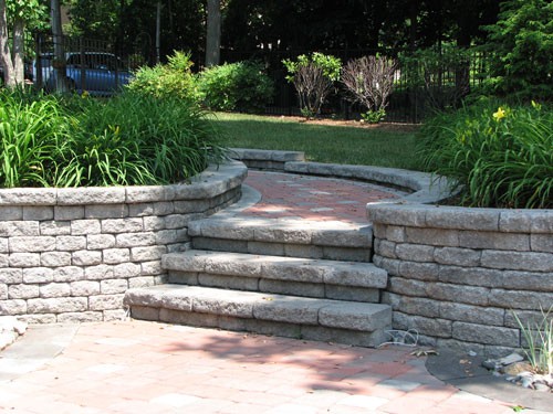 Outdoor stairs made of stone pavers leading to patio in Virginia