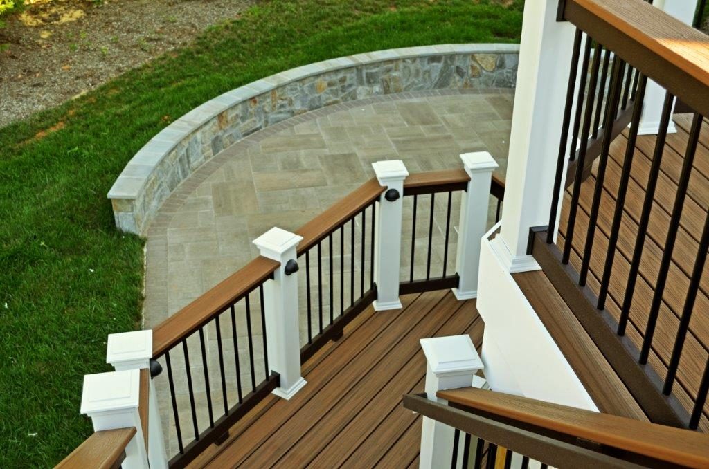 Modern deck design with stairs leading to stone patio