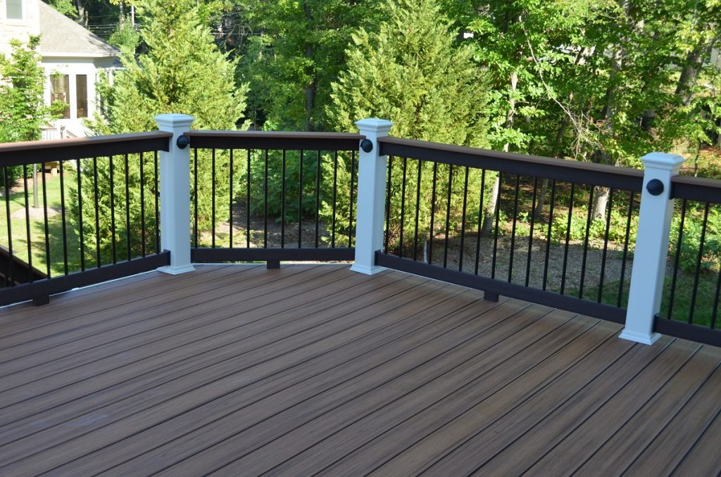 Custom composite deck surrounded by trees in Northern VA