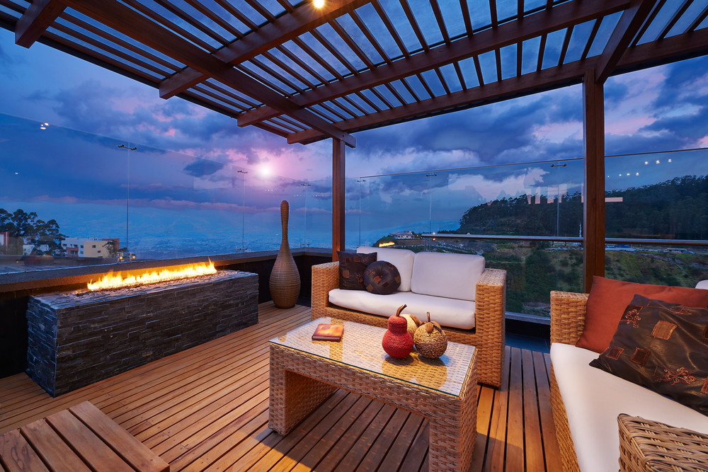 Beautiful modern terrace lounge with pergola at sunset.