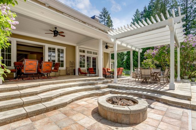 A deck with bright orange accents and a fire pit.