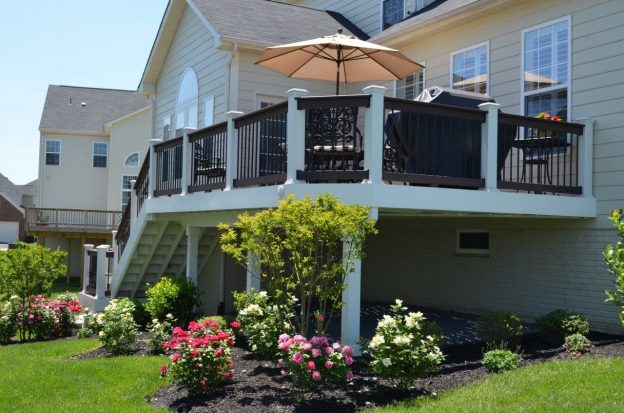 Suburban home with a porch and shrubbery