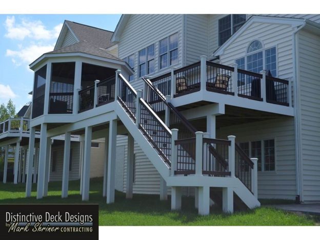 A two-story home with a screened, three-season sunroom.